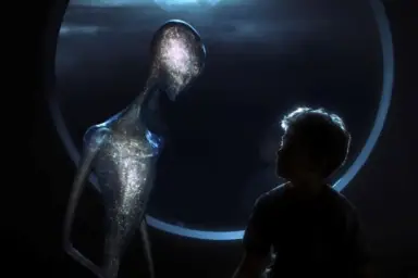 A boy next to a alien