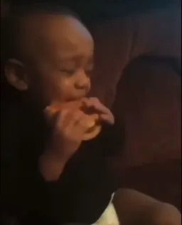 A busty boy eating hamburger