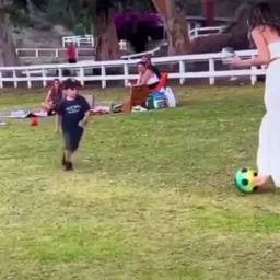 Boy tackling woman