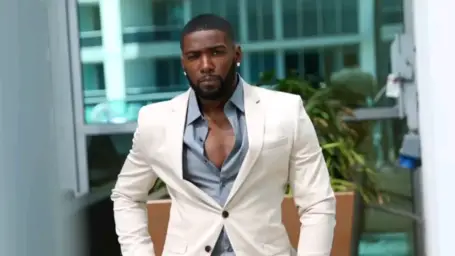 Donny Savage in white suit smiling