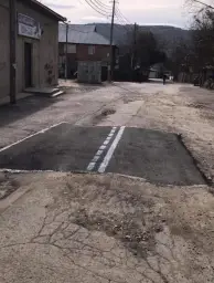 Asphalted road on unpaved road