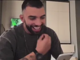 Man laughing after see mobile screen