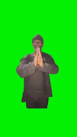 A black man doing strange performances on the green screen