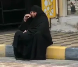 Woman with a veil in smoking