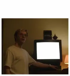 man showing what is on the TV