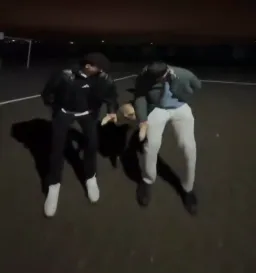 3 men dancing with a dog