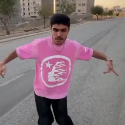 Man with pink cloths doing crazy moves 