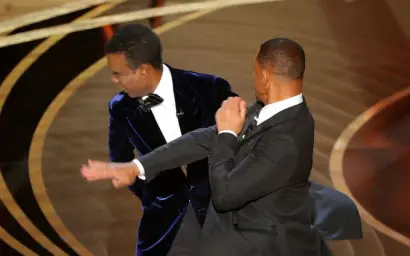 Will Smith slapping Chris Rock on stage at The Oscars