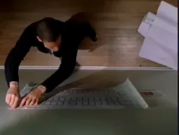 The man is finding a solution