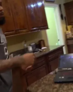 A man's fist to laptop
