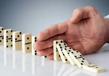 Stopping dominoes