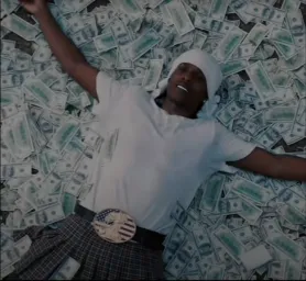 Black man lying on the money