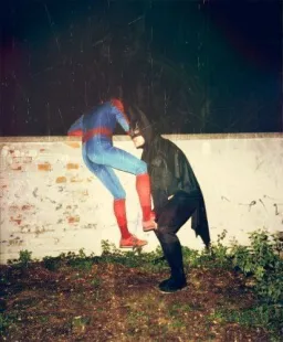 Batman and Spiderman in an attempt to escape