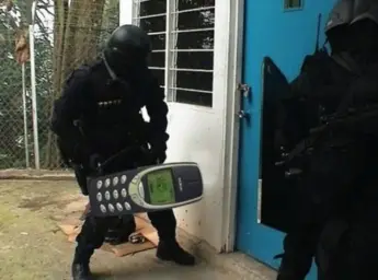 Police using phone to break door