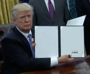 Trump holding a book