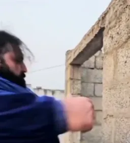 The big man in shouting and breaking the wall
