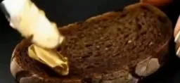 Man putting gold on bread