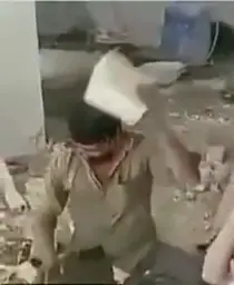 Man breaking bricks whit head 