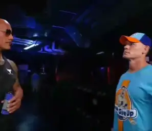 Rock and John Cena hug