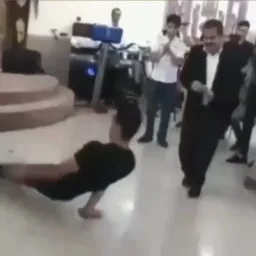 Man dancing and old man falling down