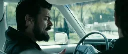 Two men talking in the car