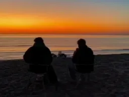 Two men speaking from night to morning
