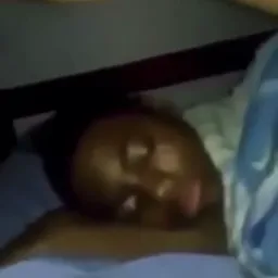 Man hitting a sleeping black boy