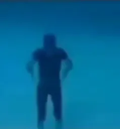 A man praying under water