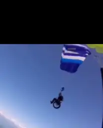 Man parachuting on wheelchair