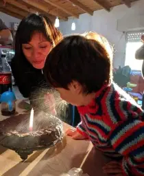 Child Spitting on Birthday Cake