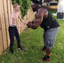 Black bodybuilder and thin boy