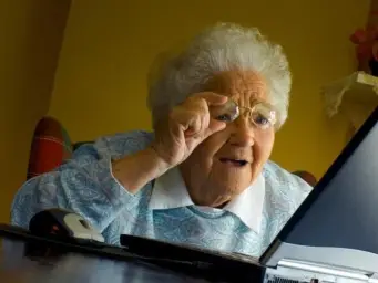 Grandma looking at laptop screen