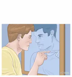 Man looking at himself in the mirror