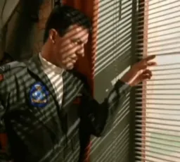 An upset man staring out