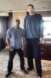 Dwayne The Rock Johnson Standing Next to Sun Ming Ming