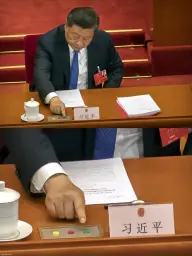 Xi pressing the button