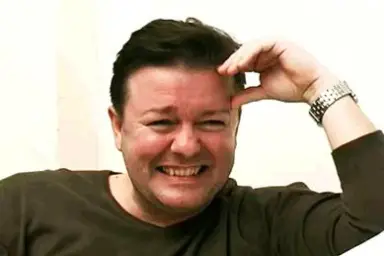 Laughing Ricky Gervais