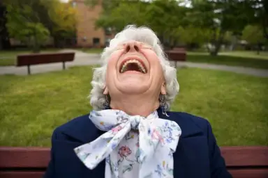 Elderly woman laughing LOL